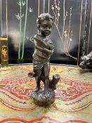 A BRONZE FIGURE OF A GIRL HOLDING A PAIR OF DOVES