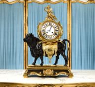 A FINE 19TH CENTURY FRENCH GILT AND PATINATED BRONZE CLOCK IN THE FORM OF A BULL