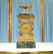 AN EARLY 19TH CENTURY FRENCH EMPIRE STYLE MARBLE AND ORMOLU MANTEL CLOCK