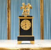 AN EARLY 19TH CENTURY FRENCH EMPIRE CLOCK WITH MOVING BUTTERFLY