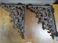 **A pair of cast metal rust effect brackets**