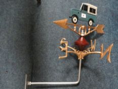 **A cast metal Land Rover wall mounted weather vane**