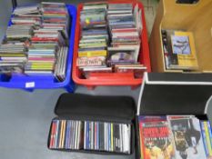 Three trays of assorted CD's and DVD's
