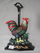 **A cockerel door stop**