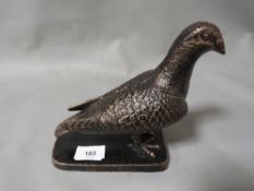 **A cast pigeon on base**