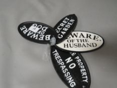 **Four oval cast iron signs**