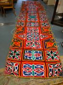 A large sewn quilted pennant 480 x 123 cm