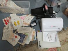 A collection of crafting items, to include a Fabmatic embossing machine, a Sizzly Bigshot die cutter