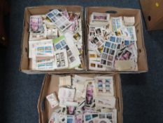 Three boxes of mixed stamps