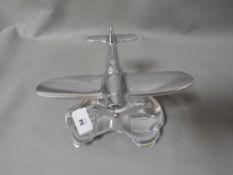 **A polished aluminium plane and map**