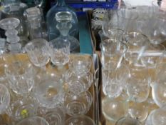 A large quantity of assorted glassware to include drinking glasses, candlesticks etc (6 trays)