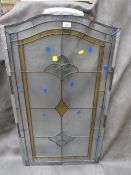 A large leaded glass doo panel with backing glass