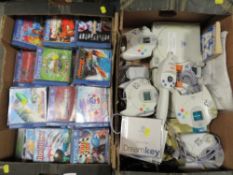 Three Sega dreamcasts together with games and accessories