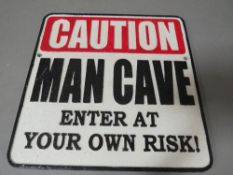 **Caution man cave sign**