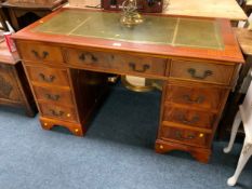 A twin pedestal leather topped desk W 122 cm
