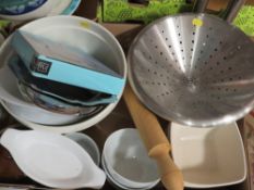Five trays of kitchen ceramics to include a cast iron crock pot