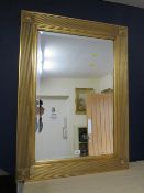 A gilt framed rectangular bevel edge wall mirror, H 94 cm, W 68 cm