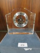 A glass mantel clock