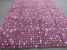A large woollen rug with a modern purple pattern 295 x 224 cm