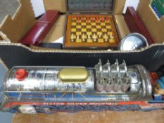 A box of collectables to include a tin plate train etc