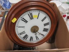 A circular wall clock with two weights