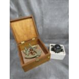 A Plastimo compass together with a cased sextant