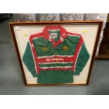 A framed Leicester Tigers rugby shirt with various signatures