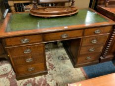 An antique oak twin pedestal leather topped desk W 138 cm