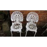 A pair of aluminium cast garden chairs
