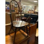 An Ercol dark oak armchair