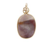 A gold wire-framed agate pendant.