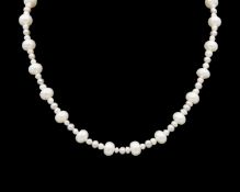 A freshwater pearl necklace and bracelet set.