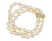 A three-row golden South Sea cultured semi-baroque pearl bracelet.
