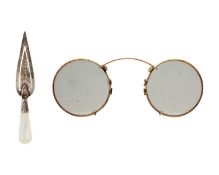 A Victorian silver and mother-of-pearl trowel bookmark, and a pair of gold-plated spectacles.