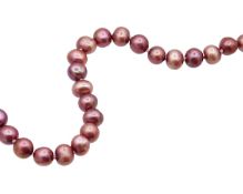 A purplish pink cultured pearl bracelet.