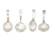 Two similar George III silver caddy spoons by Elizabeth Morley.