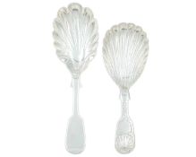 Two Victorian provincial silver caddy spoons with shell bowls.