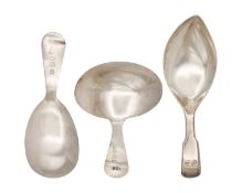 A selection of three George III silver caddy spoons.