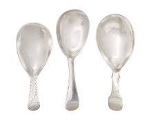 A selection of three George III silver caddy spoons.
