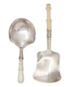Two early Victorian silver caddy spoons with shovel bowls.
