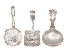 A selection of three early 19th century silver caddy spoons.