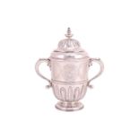 A George I Britannia standard silver loving cup and cover, London 1718, William Fawdrey bearing "
