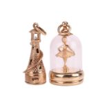 Two 9ct gold pendant charms, including a lighthouse, the interior with a faux pearl and signed by