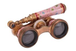 A pair of 20th century opera glasses, with folding handle, in brass with mother of pearl caps and pi