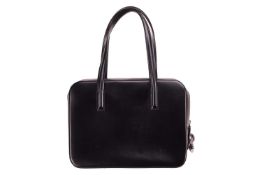 Cartier - a 'Panthere' Boston bag in black leather, top zipper closure open to reveal leopard print 