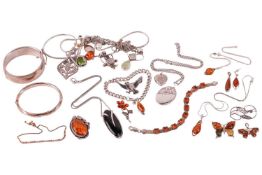 A group of silver and white metal jewellery; including a hinged silver bangle with foliate engraved 