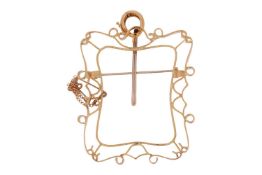 A brooch mount in the form of a frame; with scrolled edges and open gallery, hinge-pin to reverse wi