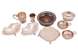 A pair of silver taste vin, of traditional form with entwined serpent handles, London 1935 by C.J.Va