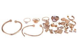 A collection of 9ct gold and yellow metal jewellery items, comprising two diamond-set rings with acc