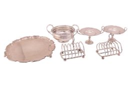 A George III twin-handled circular bowl with tongue and dart border, reeded scroll handles and a cir